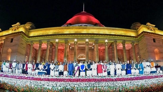 President Droupadi Murmu and Vice President Jagdeep Dhankhar with Prime Minister Narendra Modi and his council of ministers at the Rashtrapati Bhavan on Sunday.