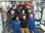 This screengrab from NASA shows astronaut Suni Williams (seated L) and Butch Wilmore (seated R) posing with the crew of the International Space Station (ISS) after the docking of the Boeing Starliner on June 6, 2024. 