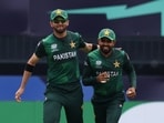 Pakistan's Babar Azam celebrates with Shaheen Shah Afridi during the T20 World Cup match against India.