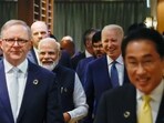 Japan's Prime Minister Fumio Kishida, front right, Australia's Prime Minister Anthony Albanese, front left, Prime Minister Narendra Modi, back left, and U.S. President Joe Biden walk as they hold a Quad meeting on the sidelines of the G7 summit, at the Grand Prince Hotel in Hiroshima, Japan