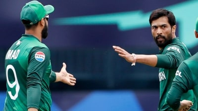 Pakistan's Mohammad Amir and Imad Wasim during their Group A match against India in the ICC T20 World Cup 2024. (ANI)