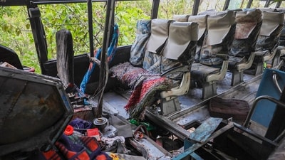 Reasi: The damaged bus, which was carrying pilgrims. (PTI) Reasi: The damaged bus, which was carrying pilgrims. (PTI)