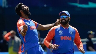 India's Jasprit Bumrah celebrates with teammate Rohit Sharma after Pakistan's Azam Khan was dismissed during the ICC men's Twenty20 World Cup 2024 group A cricket match between India and Pakistan (AFP) India's Jasprit Bumrah celebrates with teammate Rohit Sharma after Pakistan's Azam Khan was dismissed during the ICC men's Twenty20 World Cup 2024 group A cricket match between India and Pakistan (AFP)
