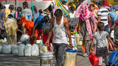 Residents fill water from a tanker amid water crisis, at the Vivekanand Camp, Chanakyapuri area, in New Delhi, Thursday, June, 6, 2024. (PTI)
