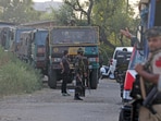 Kathua: Security forces stand guard near the site of an encounter between security forces and terrorists. 