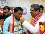 Odisha chief minister-designate Mohan Charan Majhi being congratulated by Union ministers Dharmendra Pradhan and Rajnath Singh in Bhubaneswar on Tuesday. (ANI) Odisha chief minister-designate Mohan Charan Majhi being congratulated by Union ministers Dharmendra Pradhan and Rajnath Singh in Bhubaneswar on Tuesday. (ANI)