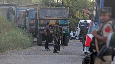 Kathua: Security forces stand guard near the site of an encounter between security forces and terrorists.