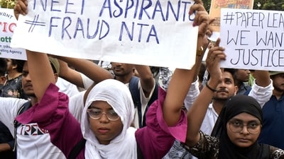 Students stage a protest against the alleged irregularities in the NEET-UG examination results and demand re-examination, in Kolkata on Monday. (saikat paul) Students stage a protest against the alleged irregularities in the NEET-UG examination results and demand re-examination, in Kolkata on Monday. (saikat paul)
