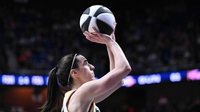 Caitlin Clark #22 of the Indiana Fever attempts a three point basket against the Connecticut Sun during the second half at the Mohegan Sun Arena on June 10, 2024 in Uncasville, (Photo by Brian Fluharty / GETTY IMAGES NORTH AMERICA / Getty Images via AFP) (Getty Images via AFP)
