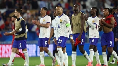 France's forward Kylian Mbappe walks off the field with teammates at the end of the International friendly football match between against Canada. (AFP) France's forward Kylian Mbappe walks off the field with teammates at the end of the International friendly football match between against Canada. (AFP)