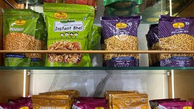 Haldiram IPO: A view shows packets of snacks on the shelves inside a Haldiram's restaurant in Mumbai, India. (Reuters)