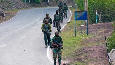 Indian Army personnel patrolling a stretch in Reasi district on Monday during a search operation after terrorists ambushed a bus carrying pilgrims on Sunday evening. Nine people were killed and 42 injured in the attack. (AFP Photo)