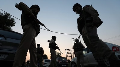 Jammu & Kashmir Police personnel stand near the site of the ongoing encounter between security forces personnel and terrorists at Saida Sukhal village in Hiranagar sector of Kathua district, on Wednesday. (PTI) Jammu & Kashmir Police personnel stand near the site of the ongoing encounter between security forces personnel and terrorists at Saida Sukhal village in Hiranagar sector of Kathua district, on Wednesday. (PTI)