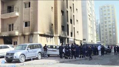 Rescuers arrive at the site of a building that caught fire in Kuwait, on Wednesday. At least 41 people died when a fire swept through a building that housed workers in Kuwait early Wednesday, and officials said the blaze appeared to be linked to code violations. (AP) Rescuers arrive at the site of a building that caught fire in Kuwait, on Wednesday. At least 41 people died when a fire swept through a building that housed workers in Kuwait early Wednesday, and officials said the blaze appeared to be linked to code violations. (AP)