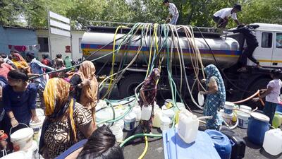 Residents of Vivekanand Camp filling water from a water tanker in Chanakyapuri area on Wednesday. (Sanjeev Verma/HT Photo) Residents of Vivekanand Camp filling water from a water tanker in Chanakyapuri area on Wednesday. (Sanjeev Verma/HT Photo)