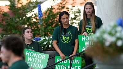 Survivors of the 2012 Sandy Hook Elementary School shooting hold signs during a rally against gun violence on Friday, June 7, 2024 in Newtown, Conn. (AP Photo/Bryan Woolston) (AP) Survivors of the 2012 Sandy Hook Elementary School shooting hold signs during a rally against gun violence on Friday, June 7, 2024 in Newtown, Conn. (AP Photo/Bryan Woolston) (AP)