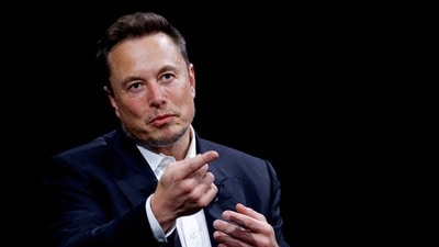 Elon Musk, CEO of SpaceX and Tesla and owner of X, formerly known as Twitter, gestures as he attends a conference. (Reuters)