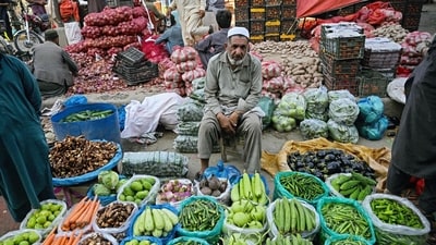 A vegetable vendor waits for customers at a market in Islamabad. (AFP) A vegetable vendor waits for customers at a market in Islamabad. (AFP)
