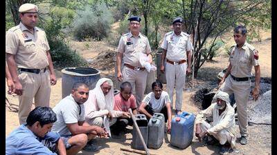 The Gurugram Police on Tuesday raided an illegal liquor distillation plant in the Aravallis near Sohna and arrested seven people including a minor. (ANI PHOTO) The Gurugram Police on Tuesday raided an illegal liquor distillation plant in the Aravallis near Sohna and arrested seven people including a minor. (ANI PHOTO)