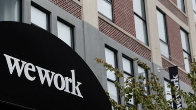 A WeWork logo is seen outside its offices in the Queens borough of New York City, US. (Reuters)