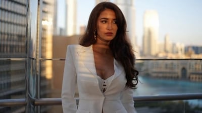 Meanwhile, for the glam picks, Disha opted for a sunkissed and glowing makeup look, which included darkened brows, shimmery gold eye shadow, smudged eyeliner, mascara on the lashes, highlighter on the contours, rouge on the cheeks, and glossy pink lip shade. Lastly, she left her voluminous, blow-dried locks open in a side parting and styled them in soft waves.&nbsp; (Instagram)
