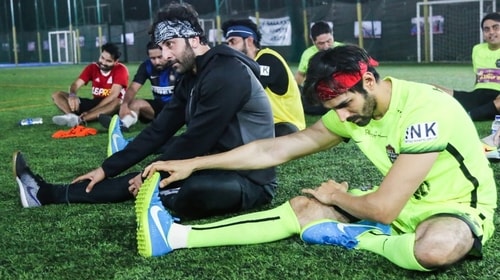 Ranbir and Kartik on a football field Ranbir and Kartik on a football field
