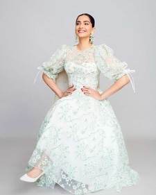 Sonam A Kapoor in a sheer white puff-sleeved tulle dress with embroidered mint green camellia flowers (Photo: Instagram) Sonam A Kapoor in a sheer white puff-sleeved tulle dress with embroidered mint green camellia flowers (Photo: Instagram)