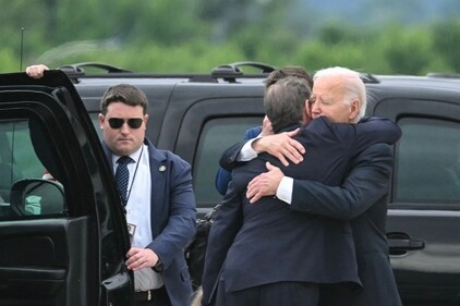 US President Joe Biden hugs his son Hunter Biden upon arrival at Delaware Air National Guard Base in New Castle, Delaware, on June 11, 2024, as he travels to Wilmington, Delaware. (AFP) US President Joe Biden hugs his son Hunter Biden upon arrival at Delaware Air National Guard Base in New Castle, Delaware, on June 11, 2024, as he travels to Wilmington, Delaware. (AFP)