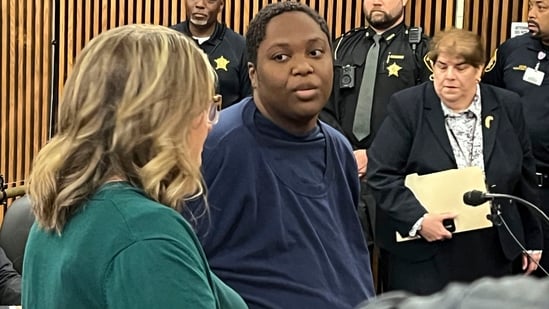 This image, from court proceedings, shows a woman accused of killing a kid outside a supermarket. (AP)