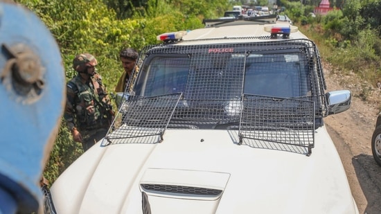 Kathua: A bullet-proof vehicle of a police officer being towed away after it came under terrorist firing. (PTI)