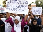 Students stage a protest against the alleged irregularities in the NEET-UG examination results and demand re-examination, in Kolkata on Monday.&nbsp;