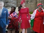 Royal supporters hold cardboard cutout of Britain's King Charles III and Princess of Wales Kate, outside the Windsor Castle where Royal family attending the Easter Matins Service in Windsor, England, Sunday, March 31, 2024. (AP Photo/Kin Cheung) Royal supporters hold cardboard cutout of Britain's King Charles III and Princess of Wales Kate, outside the Windsor Castle where Royal family attending the Easter Matins Service in Windsor, England, Sunday, March 31, 2024. (AP Photo/Kin Cheung)