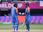India's Rohit Sharma celebrates with Virat Kohli after hitting a six.