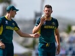 Australia's Josh Hazlewood (R) and teammate Pat Cummins during the ICC men's Twenty20 World Cup 2024 group B cricket match between Australia and England Australia's Josh Hazlewood (R) and teammate Pat Cummins during the ICC men's Twenty20 World Cup 2024 group B cricket match between Australia and England