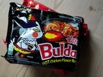 In this photo illustration two packets of Samyang noodles are pictured in London, Wednesday, June 12, 2024. Food authorities in Denmark have recalled three types of spicy instant noodle products imported from South Korea over possible risks for “acute poisoning.”  (AP Photo)
