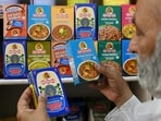 A man buys packets of MDH spices at a store in Amritsar. A man buys packets of MDH spices at a store in Amritsar.