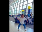 Many onlookers were surprised to see the woman dancing at the airport. Many onlookers were surprised to see the woman dancing at the airport.