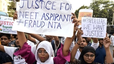 Students stage a protest against the alleged irregularities in the NEET-UG examination results and demand re-examination, in Kolkata on Monday. (saikat paul) Students stage a protest against the alleged irregularities in the NEET-UG examination results and demand re-examination, in Kolkata on Monday. (saikat paul)