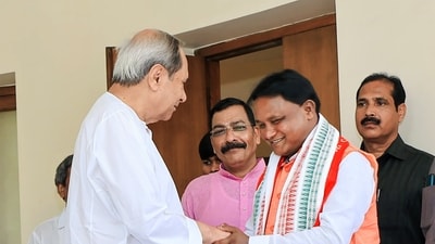 Odisha CM Mohan Charan Majhi greets former state chief minister Naveen Patnaik at Naveen Niwas on June 12. (ANI)