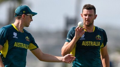 Australia's Josh Hazlewood (R) and teammate Pat Cummins during the ICC men's Twenty20 World Cup 2024 group B cricket match between Australia and England (AFP) Australia's Josh Hazlewood (R) and teammate Pat Cummins during the ICC men's Twenty20 World Cup 2024 group B cricket match between Australia and England (AFP)
