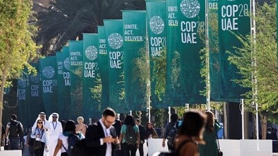 Delegates walk at the United Nations Climate Change Conference COP28 in Dubai, United Arab Emirates, December 8, 2023. (REUTERS)