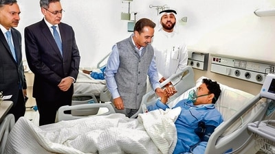 MoS Kirti Vardhan Singh with an injured person on Thursday. (PTI)