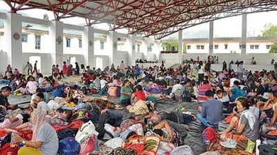 People evacuated from violence-affected areas take rest at a shelter (ANI Photo) People evacuated from violence-affected areas take rest at a shelter (ANI Photo)