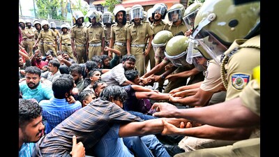 Police personnel stop the protesters in Thiruvananthapuram on Thursday. (ANI)