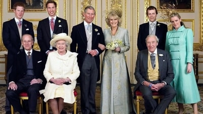 Following their wedding, Camilla faced some issues with her striking gold leaf feathers headband as the wind blew around her. (Getty)
