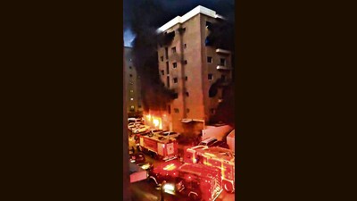 Smoke billows after a fire broke out in a building, in Mangaf, Kuwait, Wednesday. (PTI) Smoke billows after a fire broke out in a building, in Mangaf, Kuwait, Wednesday. (PTI)