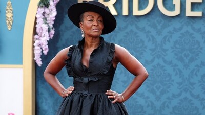 'Lady Danbury' Adjoa Andoh attended the Bridgerton Season 3 Part 2 premiere. She wore a black Paul Costelloe gown on the red carpet and styled the ensemble with block heels, a matching hat, gold bracelets, rings, and a pearl earring.&nbsp; (REUTERS)