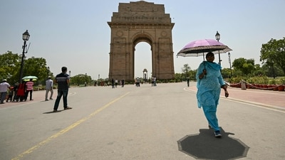 A woman holding an umbrella walks near the India Gate during severe heatwave on a hot summer day in New Delhi (AFP) A woman holding an umbrella walks near the India Gate during severe heatwave on a hot summer day in New Delhi (AFP)