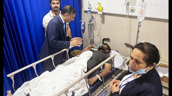 Indian ambassador Adarsh Swaika at a hospital where 11 workers injured in the fire are admitted. (X)