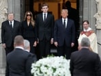Former President Donald Trump, center right, stands with his wife Melania, second left, their son Barron, (AP Photo/Rebecca Blackwell) Former President Donald Trump, center right, stands with his wife Melania, second left, their son Barron, (AP Photo/Rebecca Blackwell)